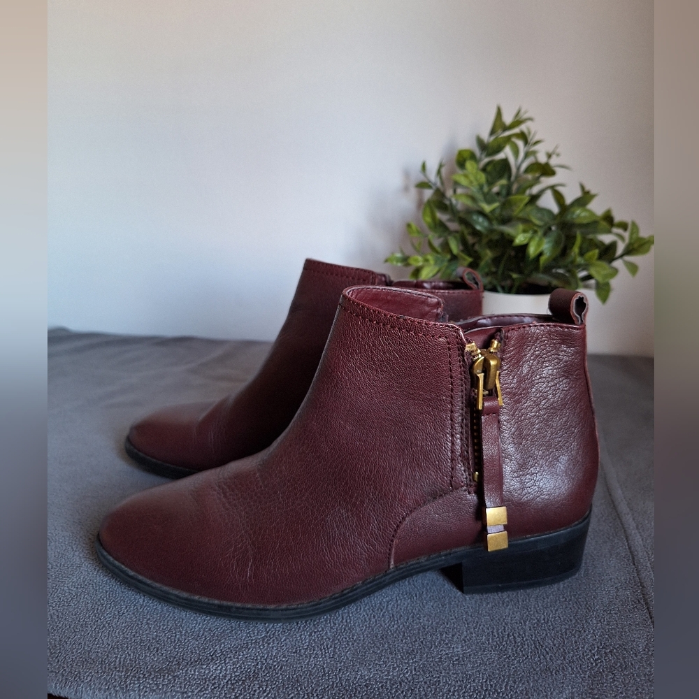 Franco Sarto wine-colored leather ankle boots with gold zipper.    8M womens